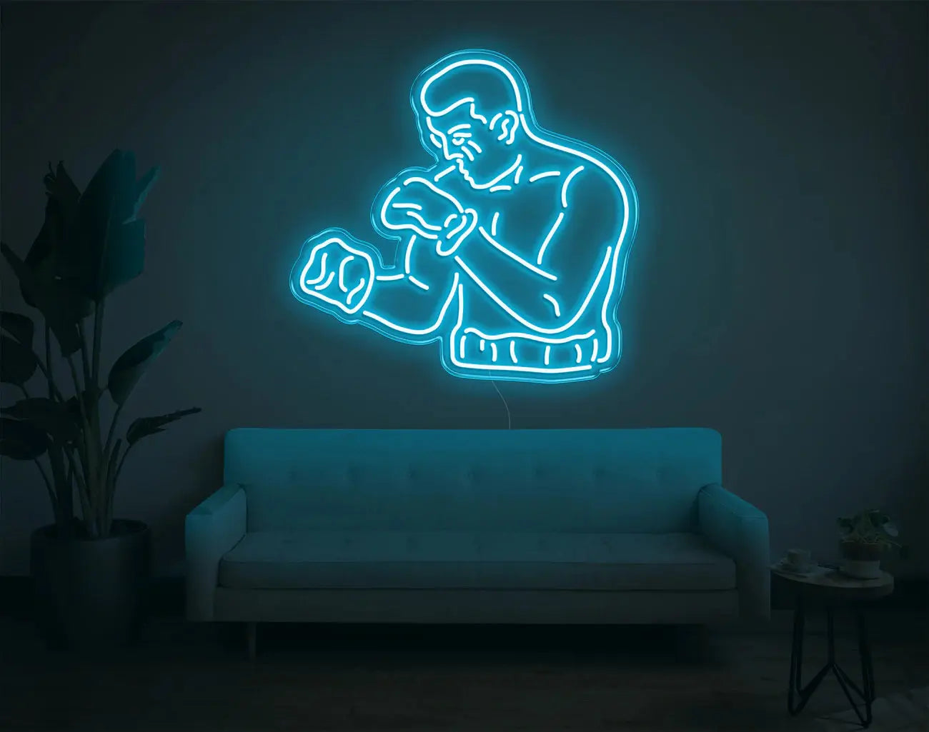 Figure de boxeur en néon LED cyan apportant une lumière ambiante moderne pour un mur créatif