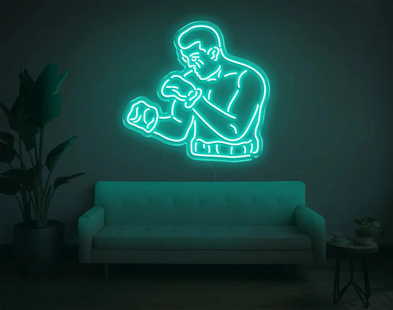 Lampe murale boxeur en néon turquoise apportant une touche sportive moderne à un intérieur contemporain