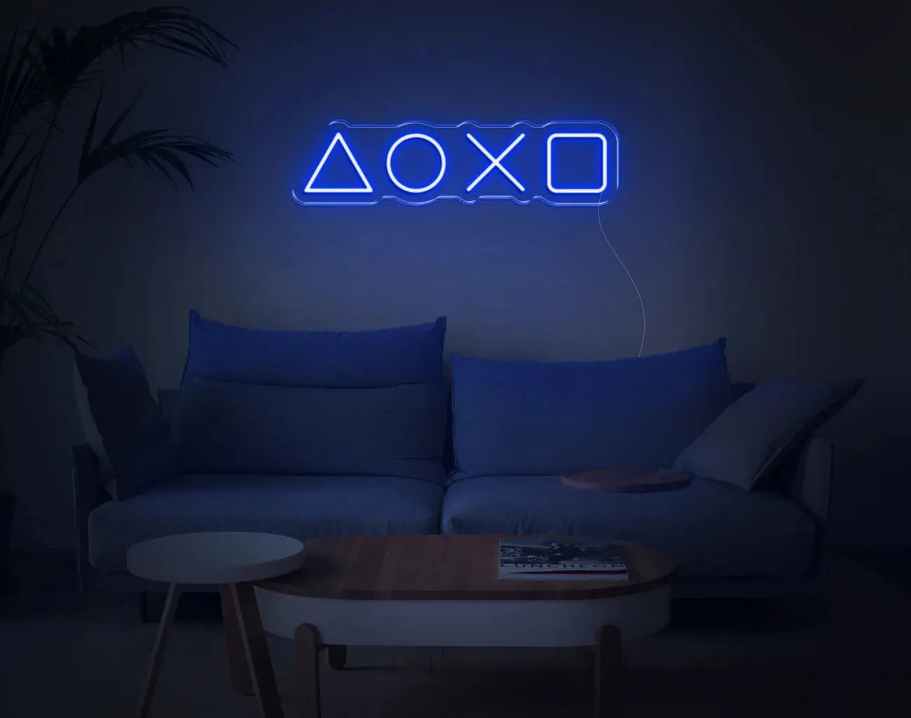 Enseigne murale gaming LED néon bleue PlayStation dans un salon