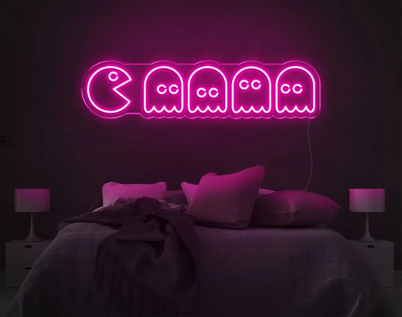 Enseigne murale LED néon Pacman rose apportant une décoration gaming rétro vive.